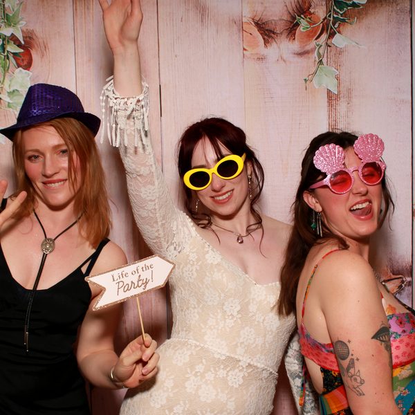 Friends posing for a photo booth strip. PicPop event photo booth, Southern California